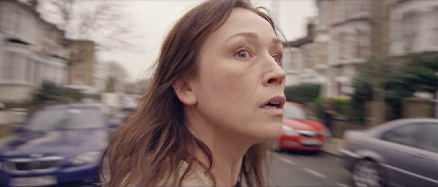 A woman looking stressed outside in a residential street, from short film Sad Pretty Pictures